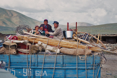 Herder family moving their ger by truck Bayan Olgii Mongolia